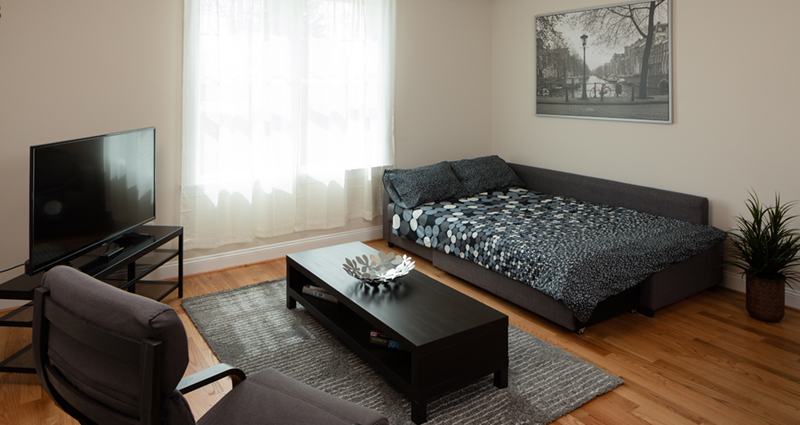 A living room with a couch and coffee table